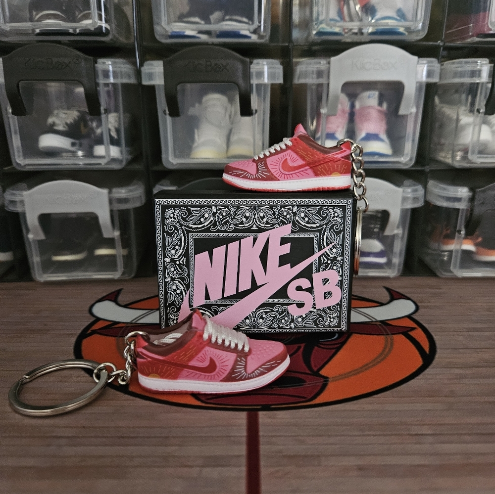 Nike SB pair of mini sneakers keychain.